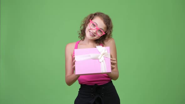 Young Happy Beautiful Nerd Woman Giving Gift Box
