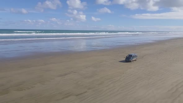 Driving on the beach by the ocean