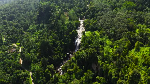 A Tropical Waterfall in a Mountain Canyon Surrounded By Jungle