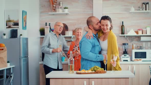 Mature Couple Hugging Flirting in Kitchen