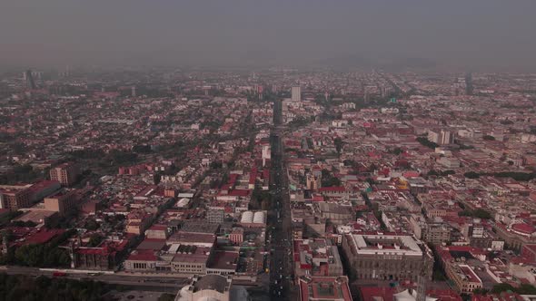 Flight over Mexico city downtown with very high pollution levels.