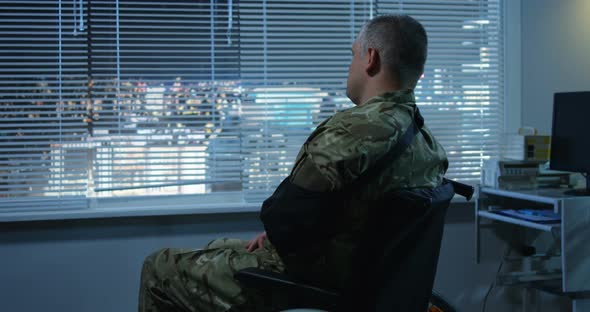 Soldier Sitting in Wheelchair in Hospital