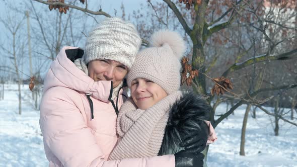 Mother with Child in Winter Park