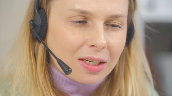 Friendly online support operator speaking with client with cheerful smile in 4k video