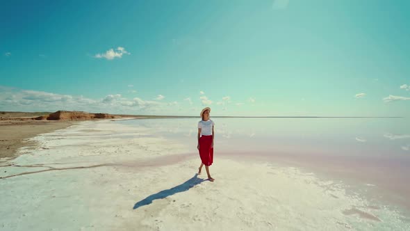 Slow Motion Footage Beautiful Landscape and Woman Walking at White Beach Near Salt Pink Lake