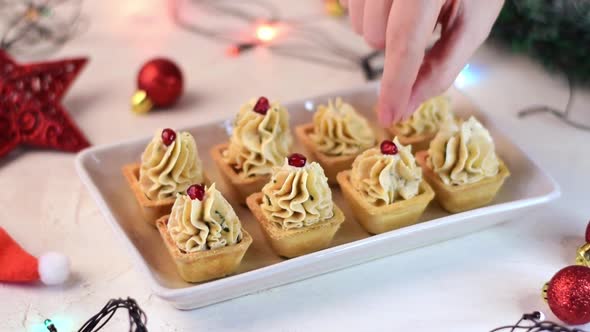 Christmas appetizers with seafood pate in tartlets