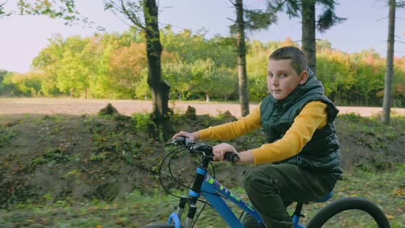 Little Boy Riding a Bicycle