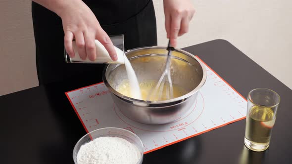 Unrecognizable Woman Whisk Beats Eggs with Sugar