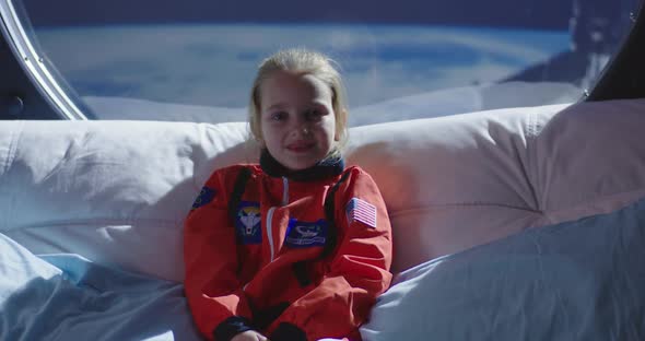 Astronaut Girl Smiling at Camera