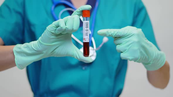 Medical Doctor Nurse Woman Wearing Protective Mask and Gloves - Holding COVID-19 Negative Blood Test