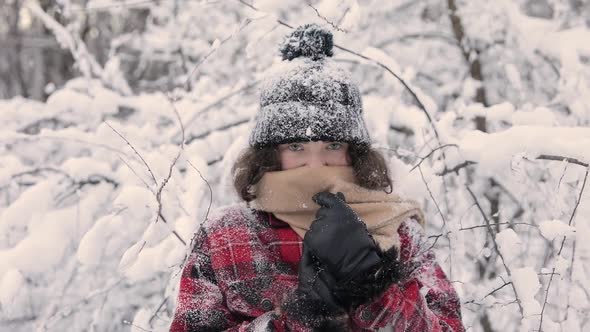 Portrait Of Cute Girl That Stands In The Snow Forest