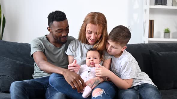 A Multiracial Family on the Couch at Home