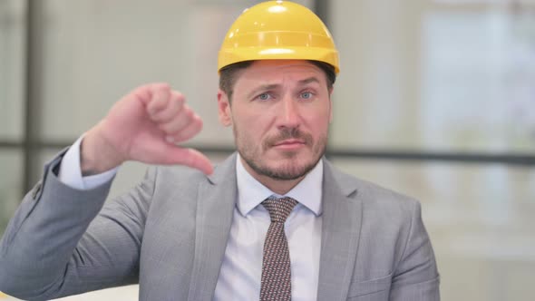 Portrait of Middle Aged Engineer showing Thumbs Down Gesture