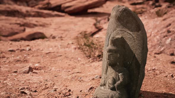 Ancient Statue on the Rocks Desert