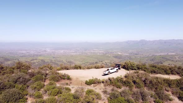 Two 4x4 vehicles reached majestic Hector Heights overlook spot. Aerial fly over view