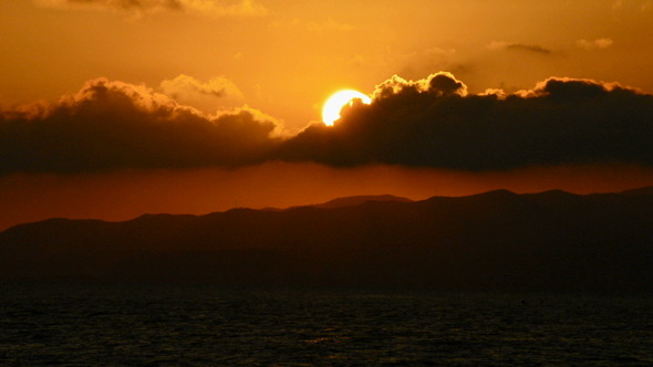 Sun Hiding Behind the Clouds at Sunset