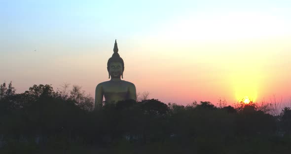 Sunset Behind The Bigest Buddha At Wat Muang