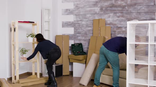 Man From Delivery Service Arriving with Boxes and Documents To Be Signed