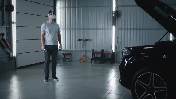 Mechanic Inspecting a Car in VR Headset