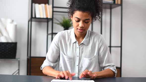 Webcam View of AfricanAmerican Female Office Employee