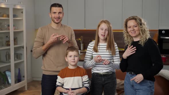 Joyful Deaf Family Talking with Gestures on Camera