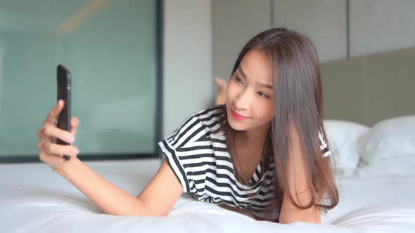 Young asian woman use smart phone