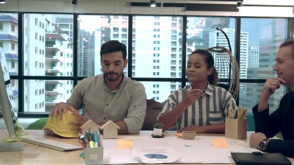 Creative Business People Group Having Conversation at Office Desk in Workplace