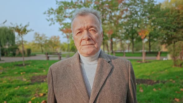 Confident Businessman Portrait in City Park