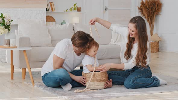 Caucasian Happy Family Young Parents with Little Daughter Having Fun Playing at Home Spend Time