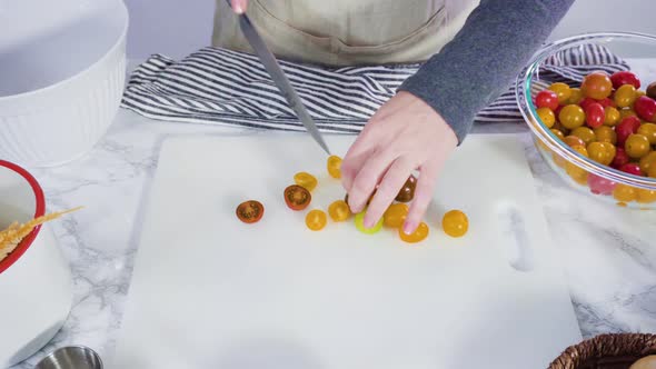 Step by step. Cutting vegetables on a white cutting board to make a one-pot pasta recipe
