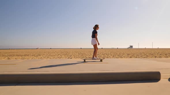 Attractive Girl Riding Longboard In Sunny Weather - wide, slow motion