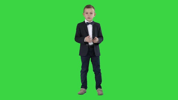 Serious Little Boy Giving a Speech To Camera on a Green Screen, Chroma Key