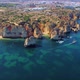 Drone shot of kayaks and boats passing in the ocean, people exploring caves and tunnels. - VideoHive Item for Sale