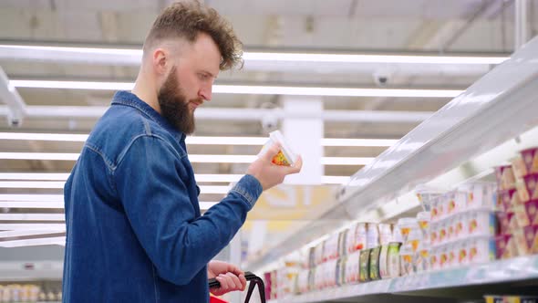 Man Doing Shopping in Dairy Products Department