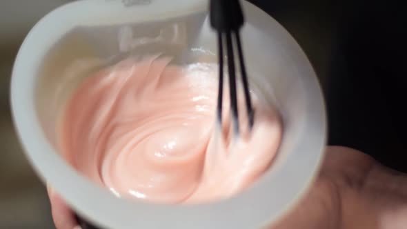 Mixing hair dye in the bowl