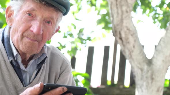 Grandpa Cries Looking at His Smartphone