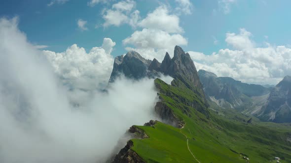 aerial drone of scenic cloud covered landscape, seceda, dolomites alps