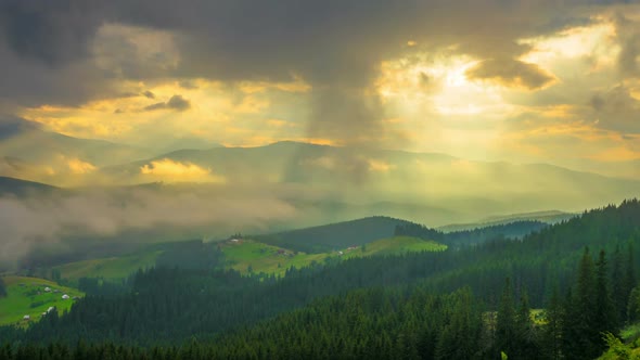 The Mountain Forest on Background of Sunset with Sun Rays