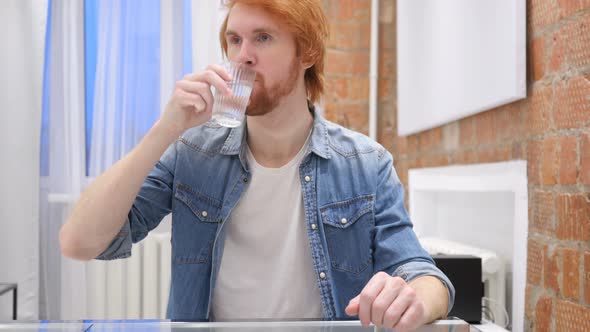 Portrait of Beard Man Drinking Water from Glass
