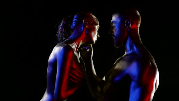 Stunning Figures of Man and Woman in Darkness Skin is Covered By Shiny Paint