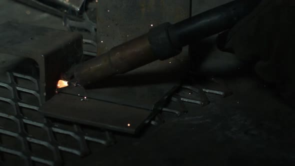 Slow motion of light sparking from arc welder.