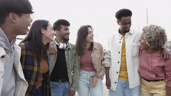 United Happy Multiracial Young Friends Standing Together Outdoors