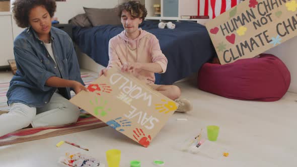 Activists Posing with Slogan Sign at Home