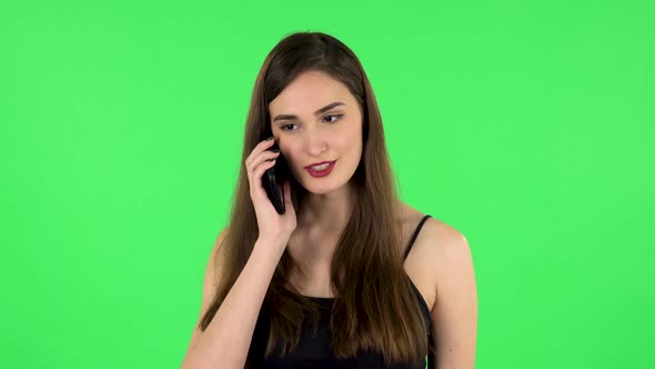 Girl Talking for Mobile Phone, Very Shocked Then Rejoice. Green Screen