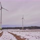 Time lapse of rotating wind turbines on a snowy field in Germany. - VideoHive Item for Sale