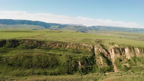 Mountain peaks and grassland