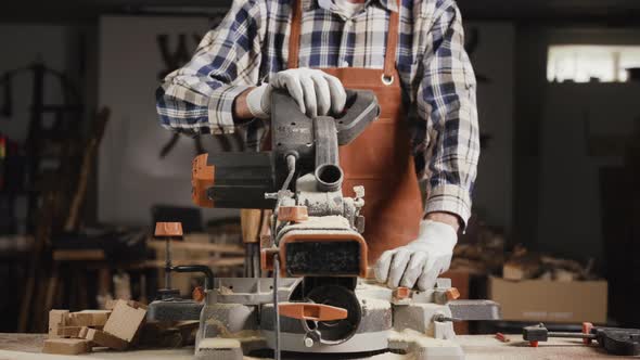 Carpenter Working At Workshop