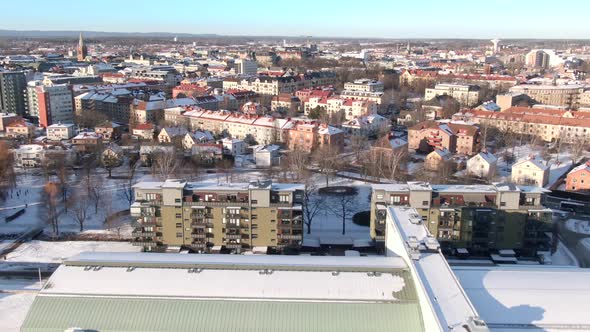 Drone shot of Orebro city in Sweden. Snow covered buildings in winter