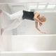 Slow Motion of a Man Performing Elements of Modern Dance in a Bright Studio - VideoHive Item for Sale