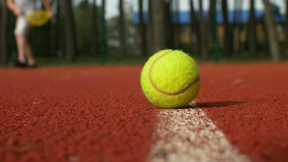 Active Sporty Man Playing Tennis Game on Court